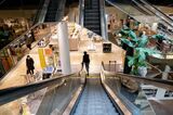 Shoppers walk through a Macys department store in Wilmington, Delaware, US.