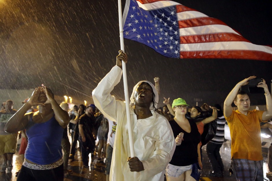 Protesters march in Ferguson on August 9, 2015, the one-year anniversary of the Michael Brown shooting.