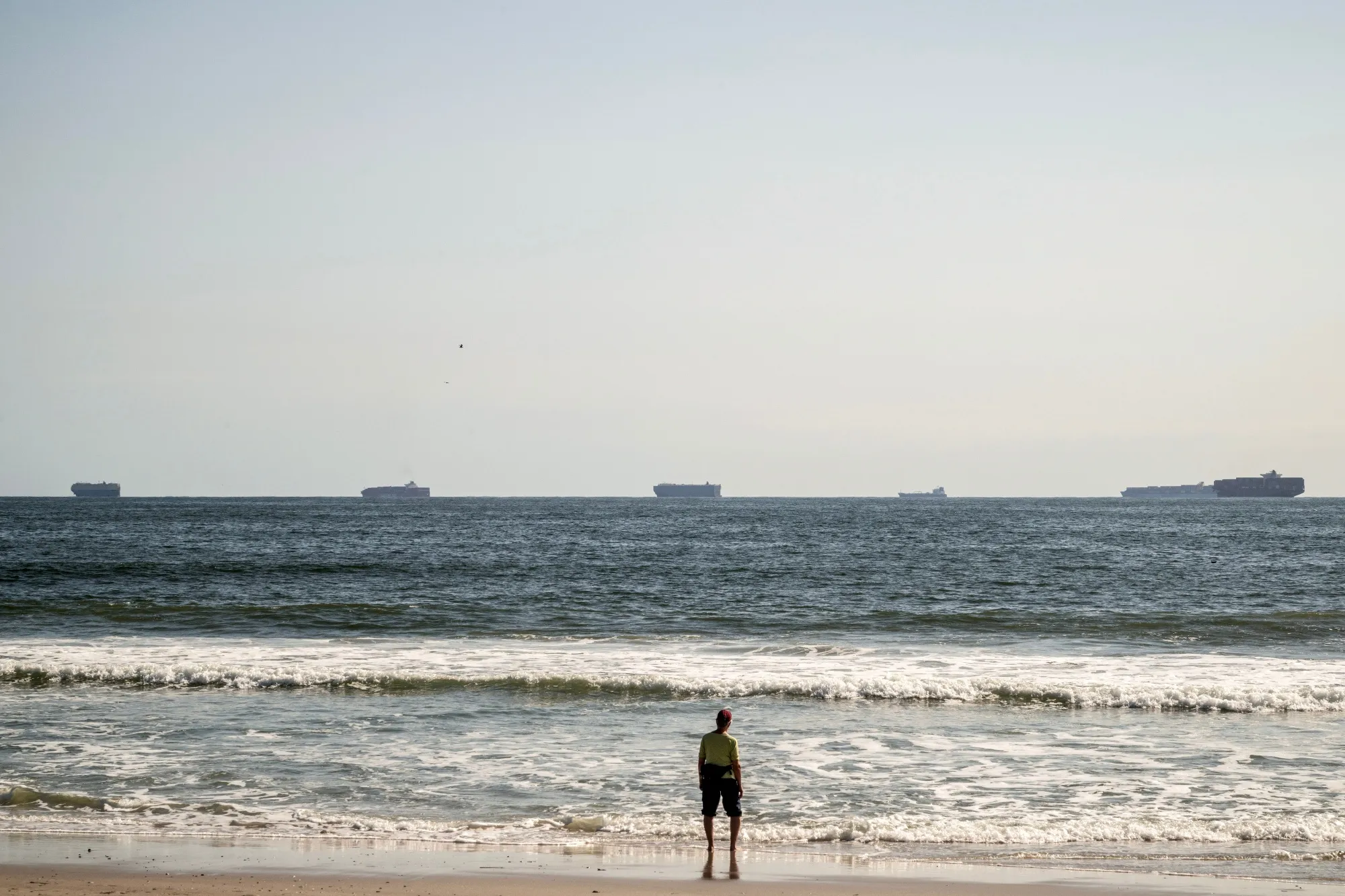 Container ships anchored off the coast of Long Beach, New York, on Oct. 3.