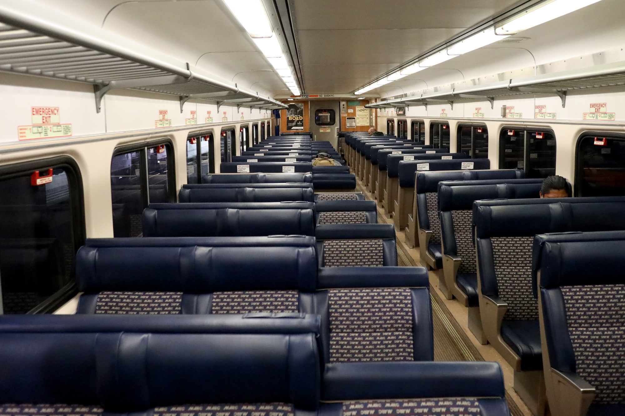 Three passengers ride a usually packed commuter MARC train out of Penn Station en route to Washington, D.C., in April.