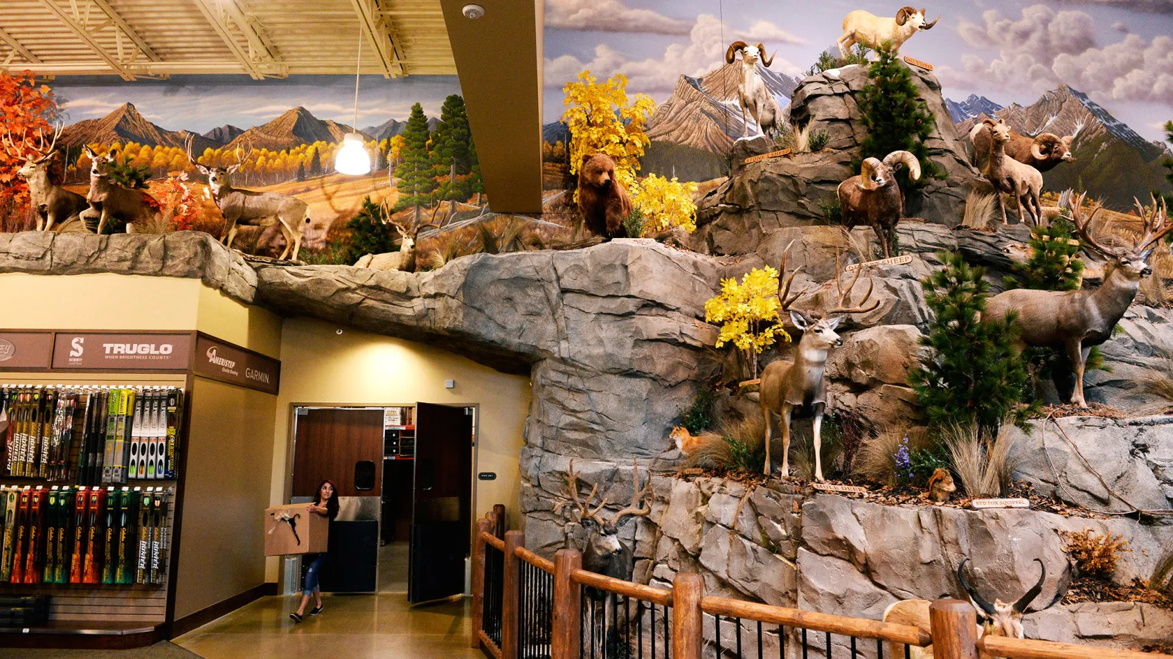 A Cabela's employee brings out boxes during set up of a store in Thornton, Colorado.
