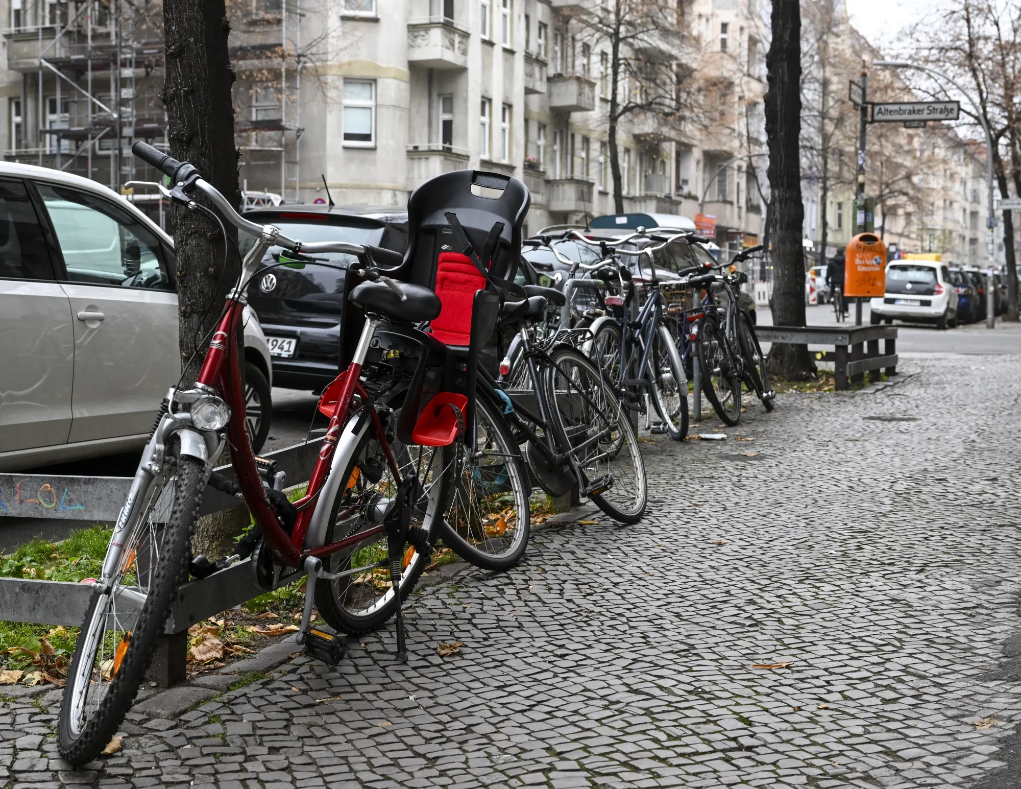 Bicycles are parked on the sidewalk in Neukölln, Berlin, in December.