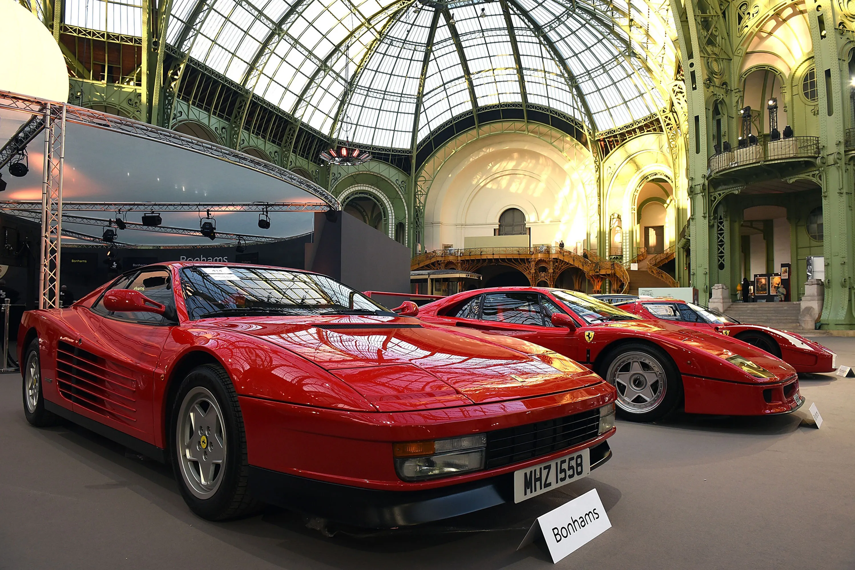 A Ferrari Testarossa and a Ferrari F40 at a vintage cars and motorbikes exhibition at Le Grand Palais, Paris. Photographer: Antoine Antoniol/Getty Images
