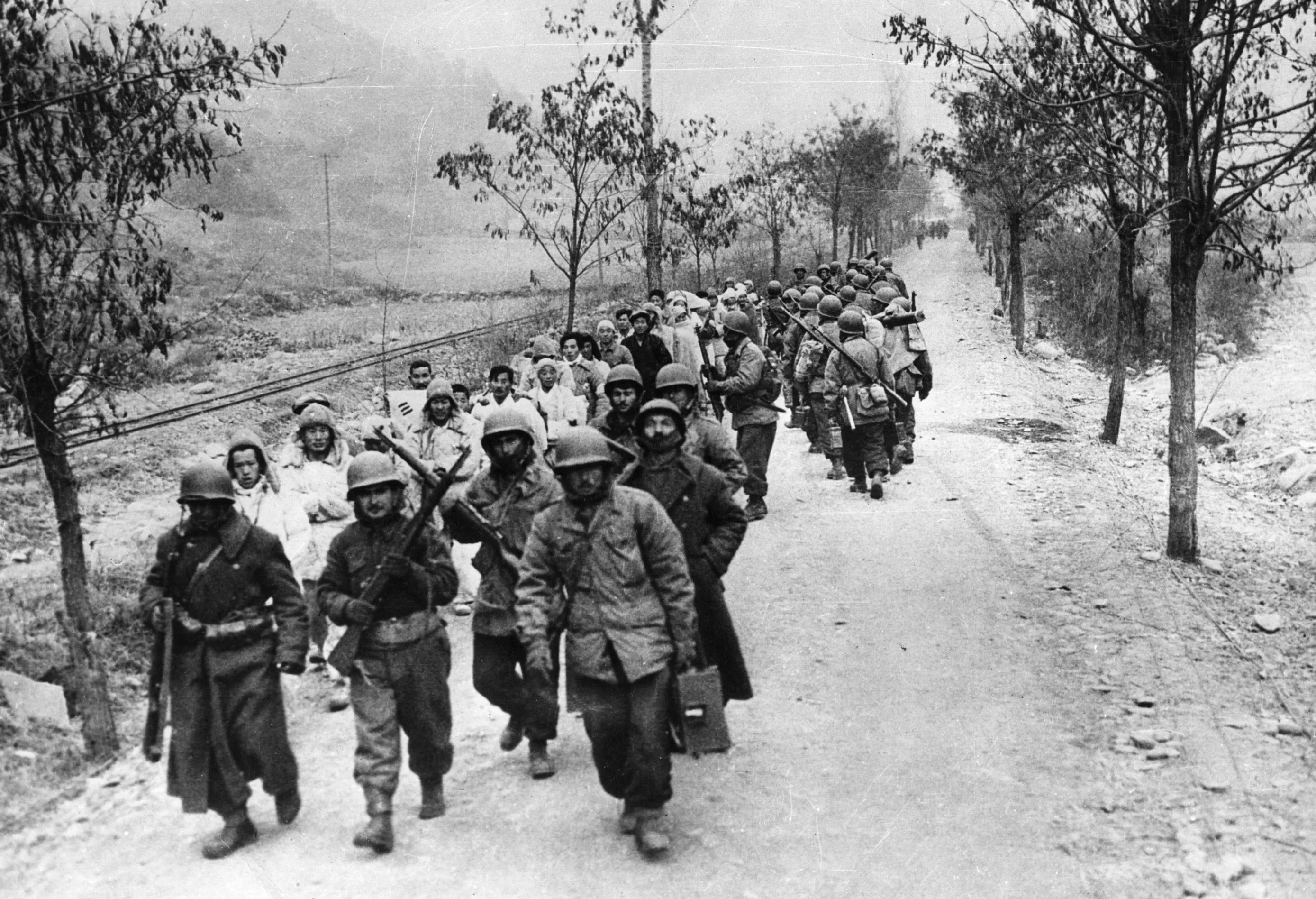Turkish troops march prisoners to the command post during the Korean War in 1950.