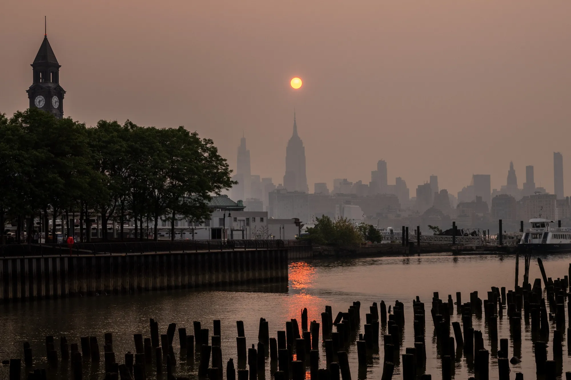 Buildings in the Manhattan skyline shrouded in smoke from Canada wildfires on June 7.&nbsp;