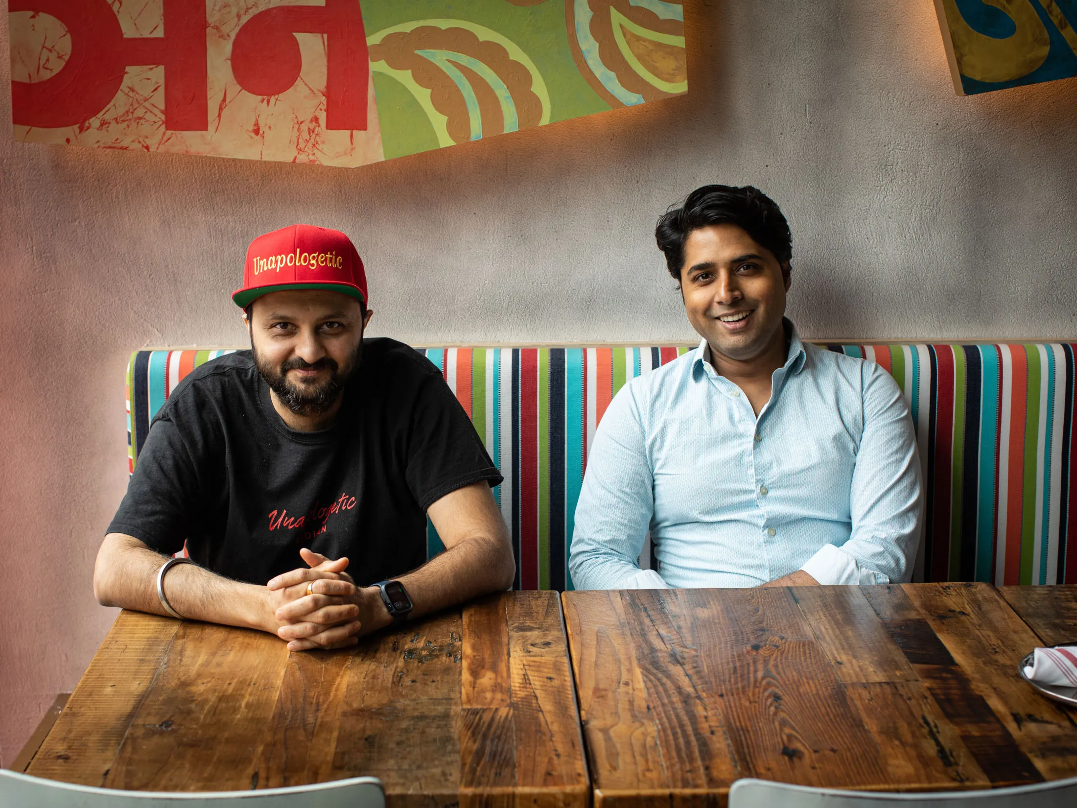 Chef and partner Chintan Pandya and restaurateur Roni Mazumdar in the dining room at Dhamaka at Essex Street Market on the Lower East Side.&nbsp;