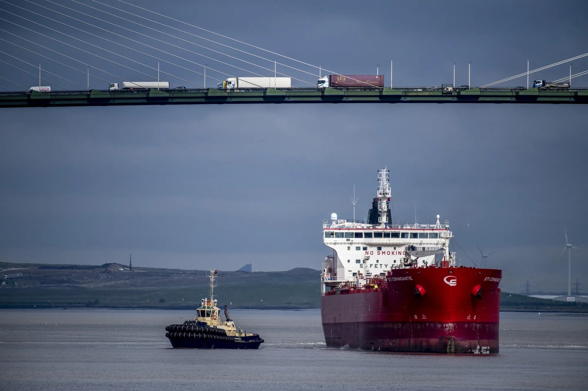 A tanker passes under a bridge after delivering a shipment of Russian diesel in Purfleet, U.K.