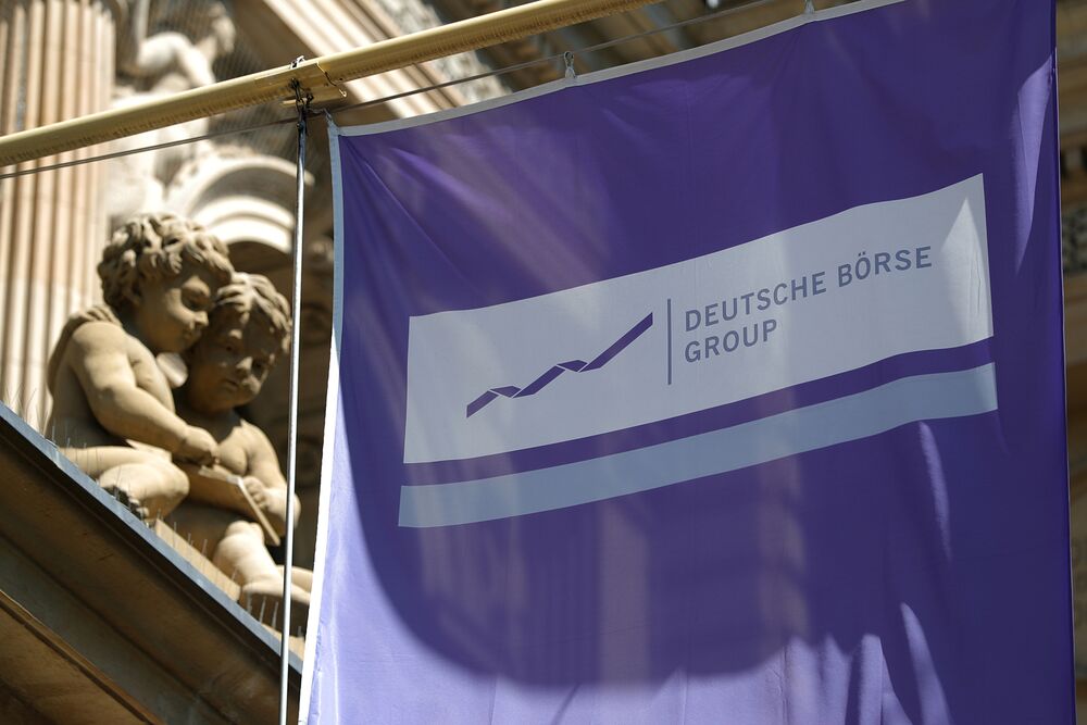 A Deutsche Boerse Group banner hangs outside the Frankfurt Stock Exchange.
