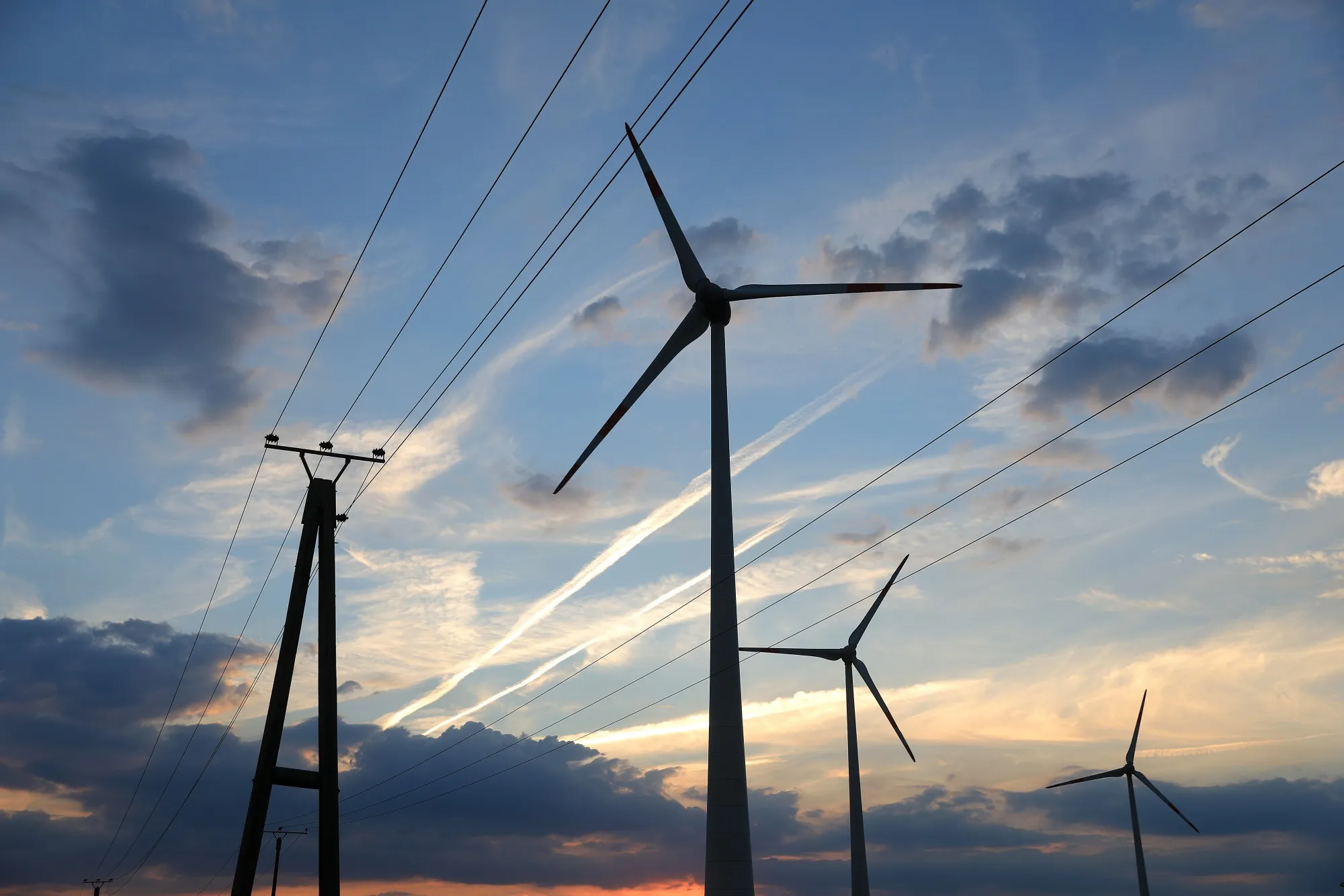 Electricity towers, power lines and wind turbines near Barnstorf, Lower Saxony, Germany.