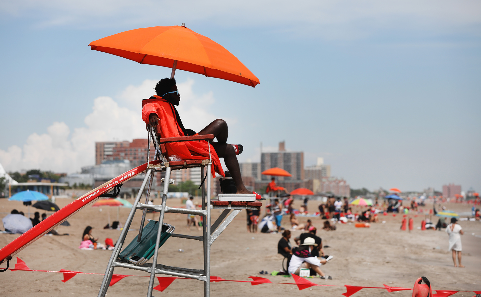 A lifeguard&nbsp;keep watch along the beach at Brooklyn's Coney Island in New York on July 1.
