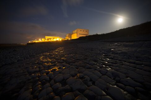 Lights illuminate Electricite de France SA's (EDF) Hinkley Point A nuclear power station.