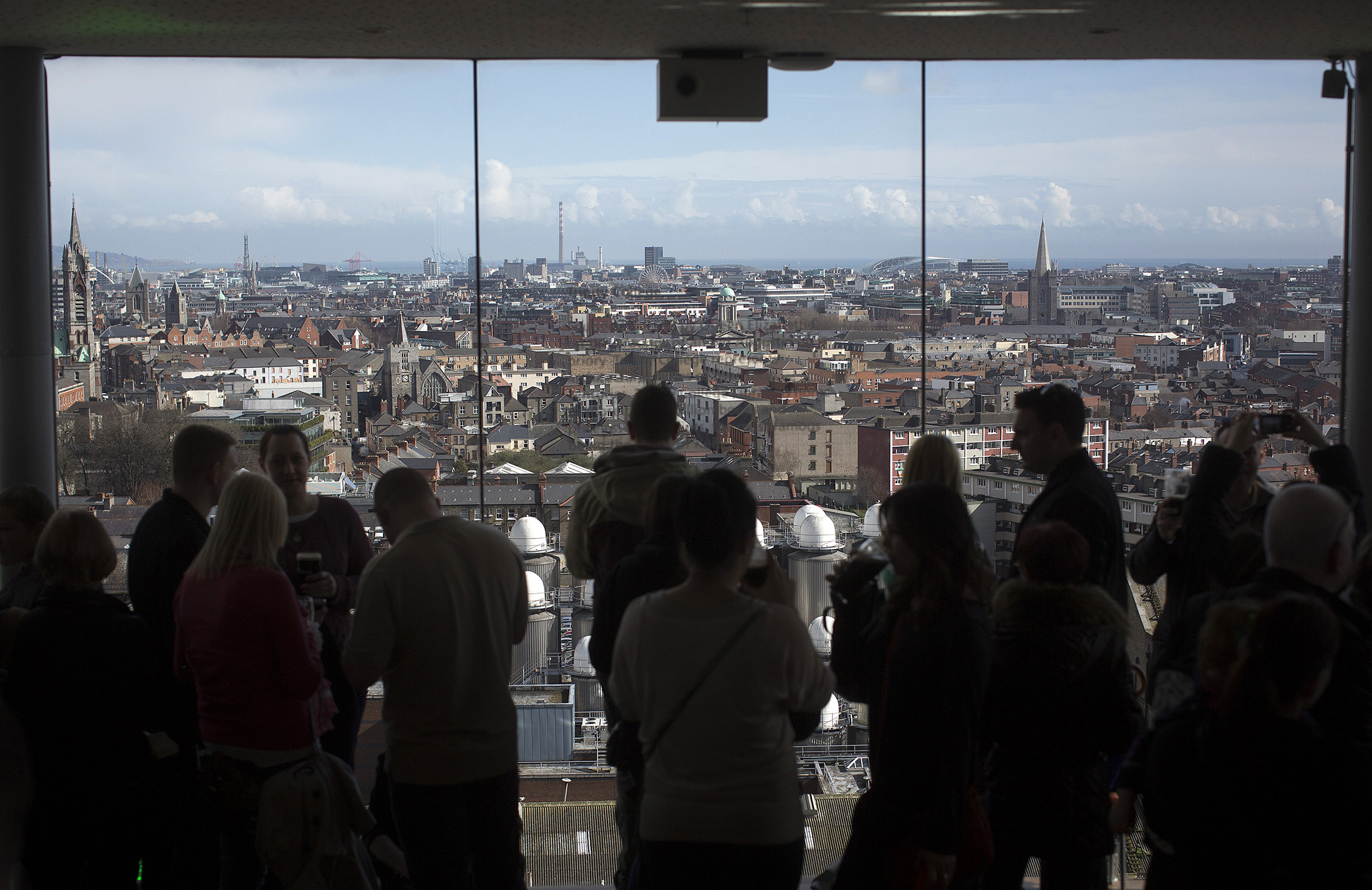 Visitors look out over the Dublin city skyline
