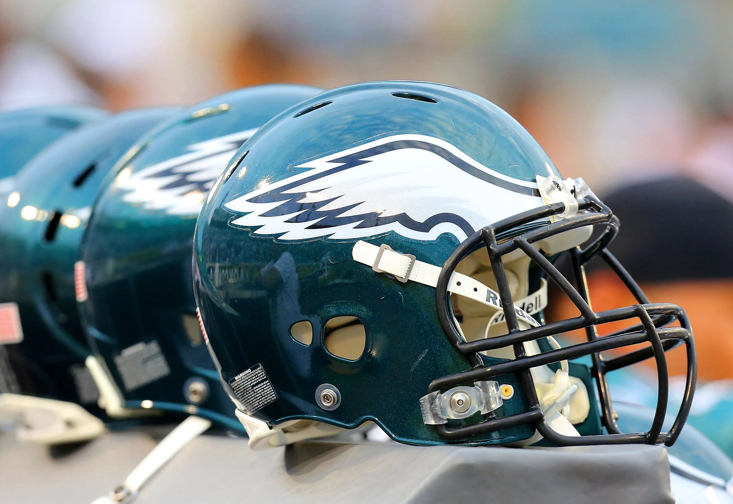 A row of Philadelphia Eagles helmets