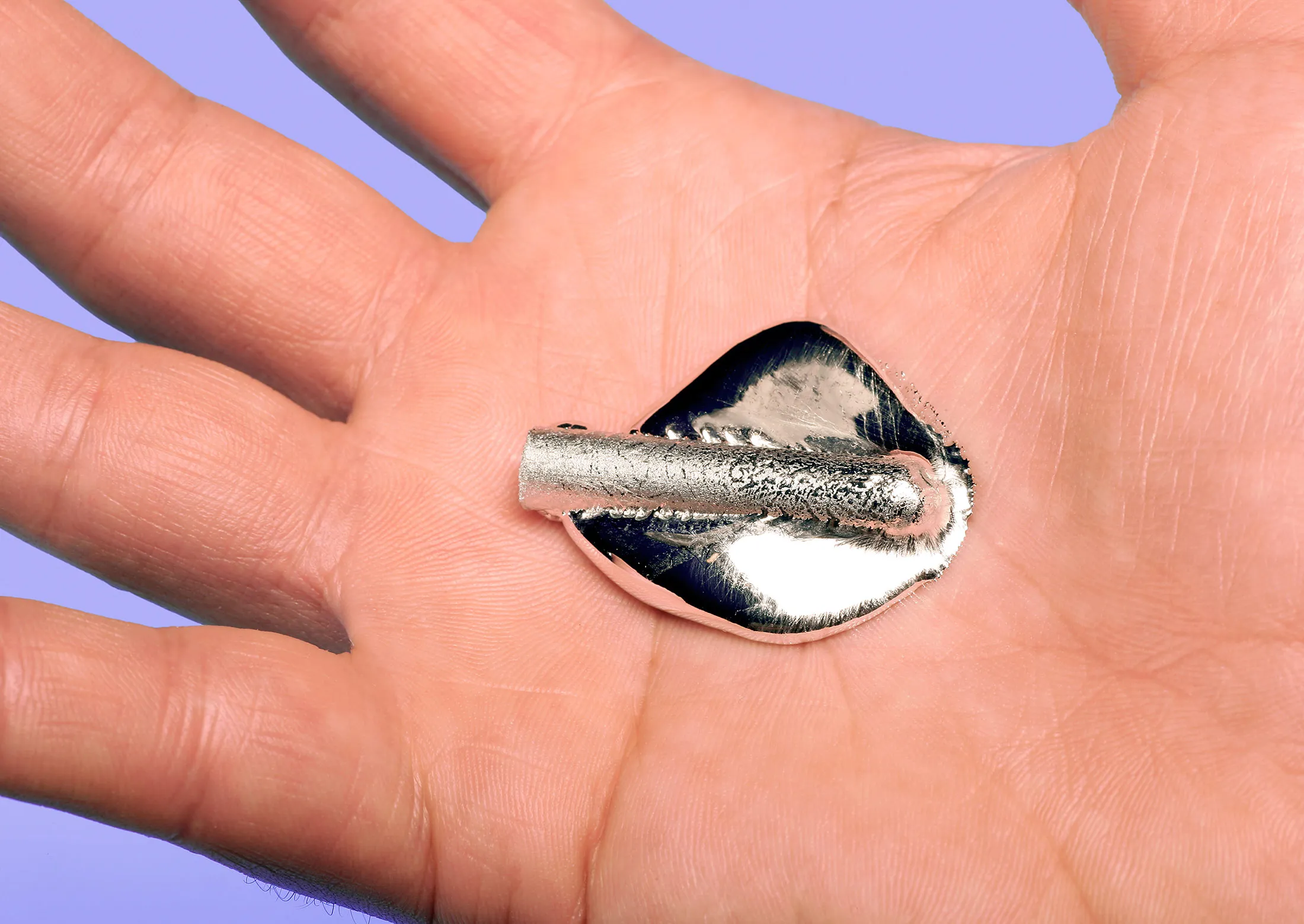 Gallium metal melting at body temperature.
