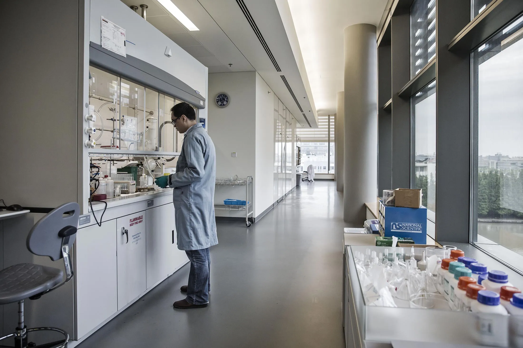 A Novartis AG employee works in a research lab at the Novartis Institutes for BioMedical Research.