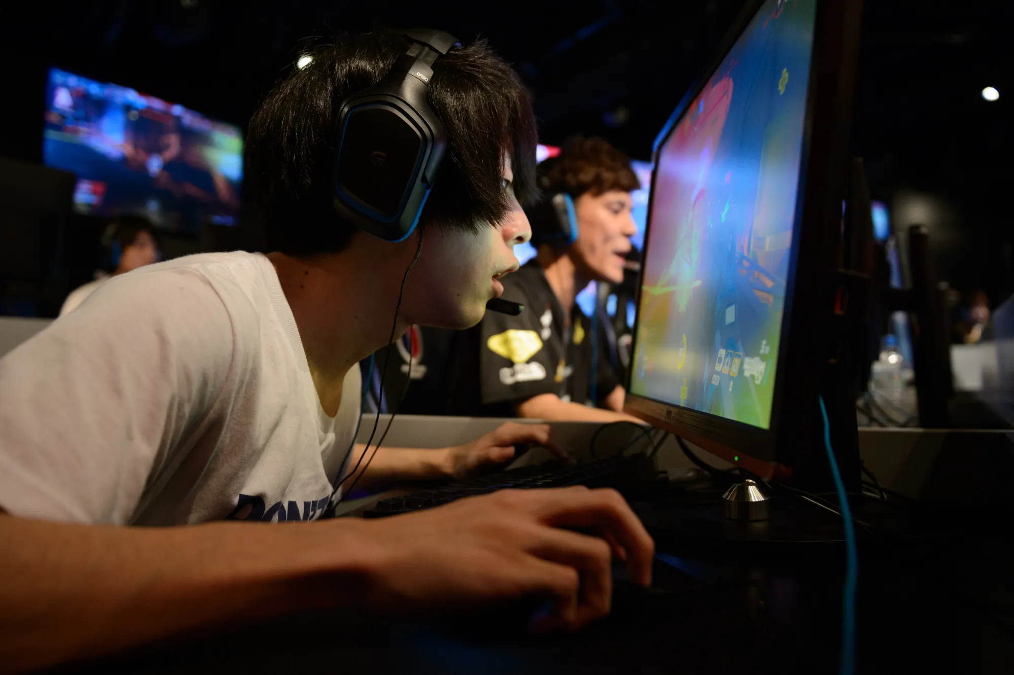 Attendees play Activision Blizzard's Overwatch game in Tokyo.