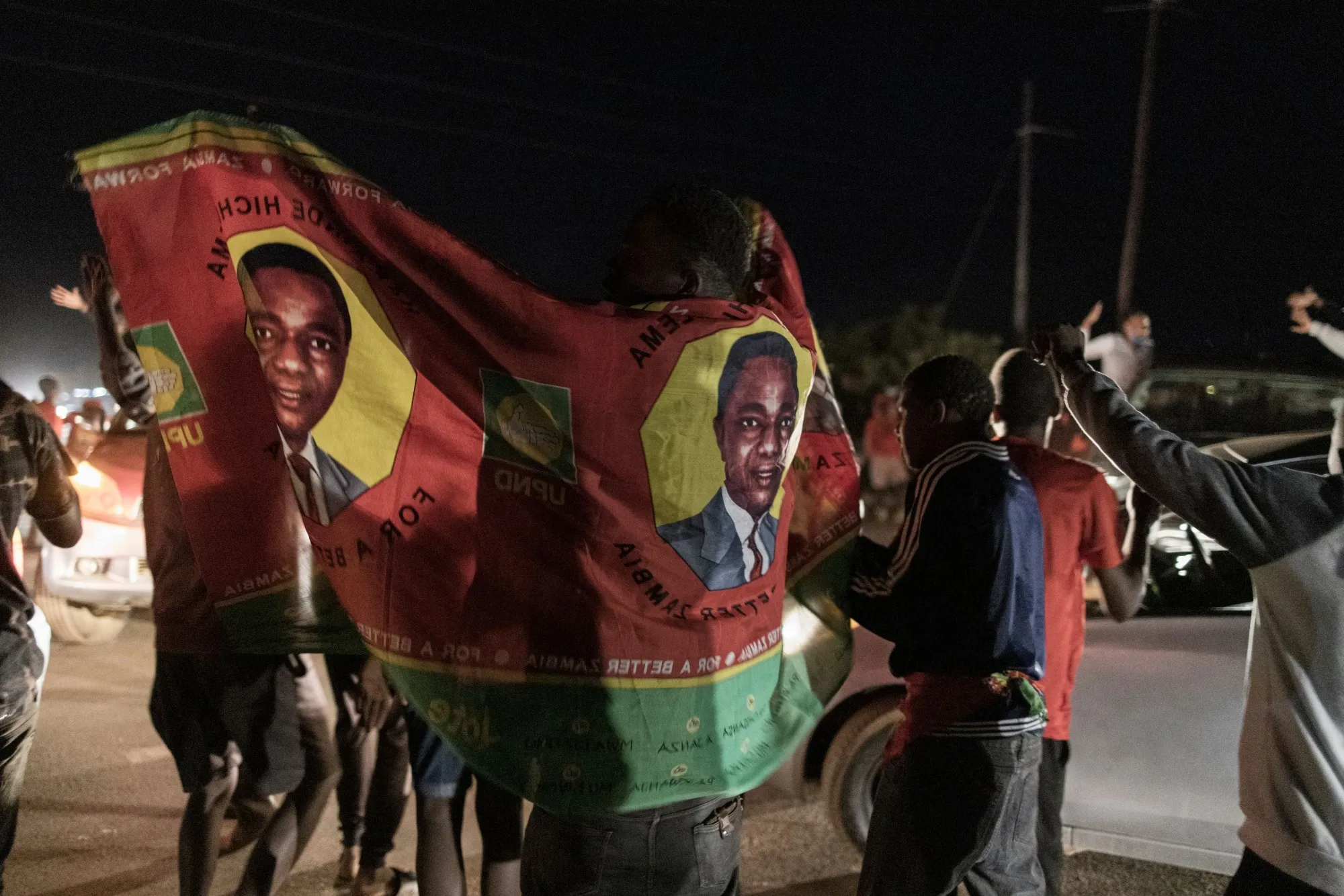 Supporters of Hakainde Hichilema parade in front of his residence celebrating in Lusaka on Aug. 15.