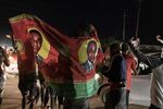 Supporters of Hakainde Hichilema parade in front of his residence celebrating in Lusaka on Aug. 15.