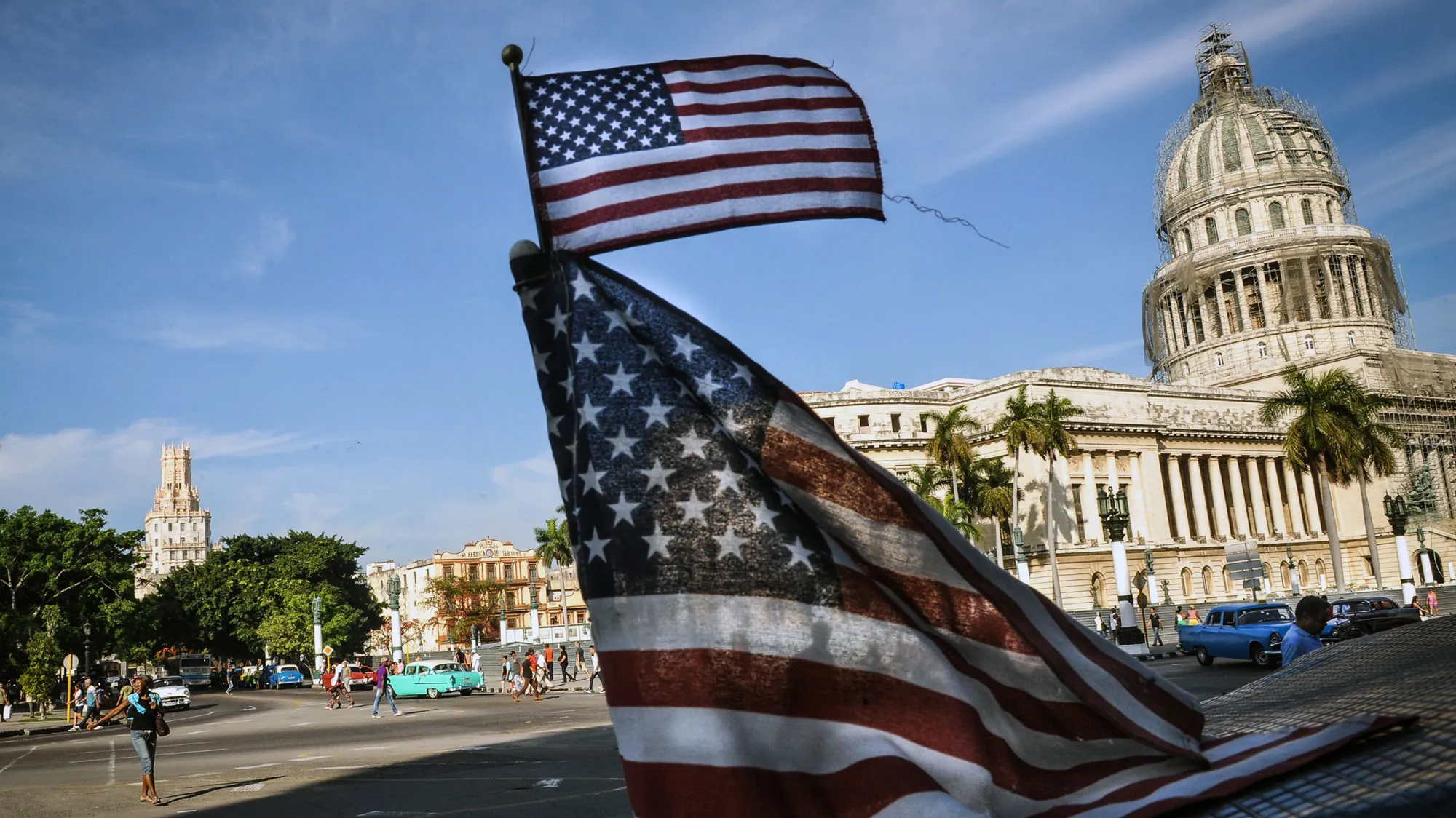 US flags are seen in a bici-taxi near the capitol in Havana on January 23, 2015. Hours into historic US-Cuba talks in Havana, a Cuban official came out to boast about the 'relaxed' atmosphere at the meeting between the old Cold War adversaries
