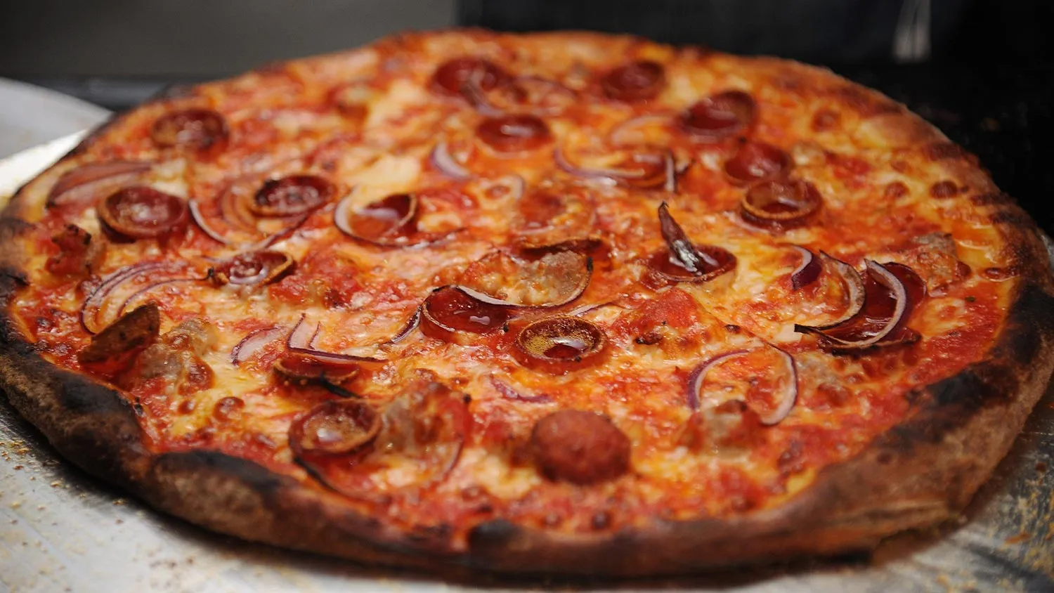 A view of pizza at a chef station at Ronzoni's La Sagra Slices hosted by Bongiovi Brand pasta sauces &amp; Adam Richman presented by Time Out New York during the Food Network New York City Wine &amp; Food Festival Presented By FOOD &amp; WINE at Esurance Rooftop Pier 92 on October 16, 2014 in New York City.
