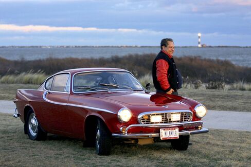 Irv Gordon stands next to his 1966 Volvo P1800. Gordon has driven the car more than 3 million miles.