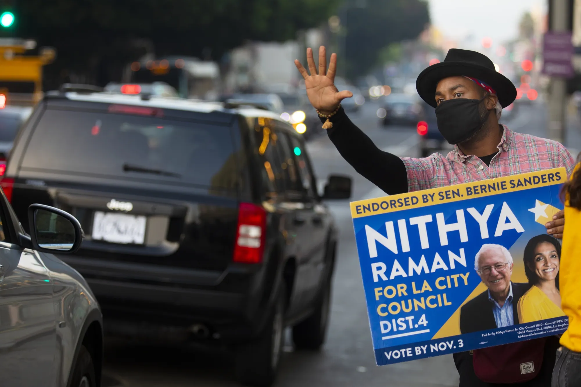 Matthew Gaston, 37, of Los Angeles, campaigns&nbsp;for LA City Council candidate Nithya Raman on Nov. 3. She’s part&nbsp;of a surge of progressive candidates that have emerged from urban centers.&nbsp;