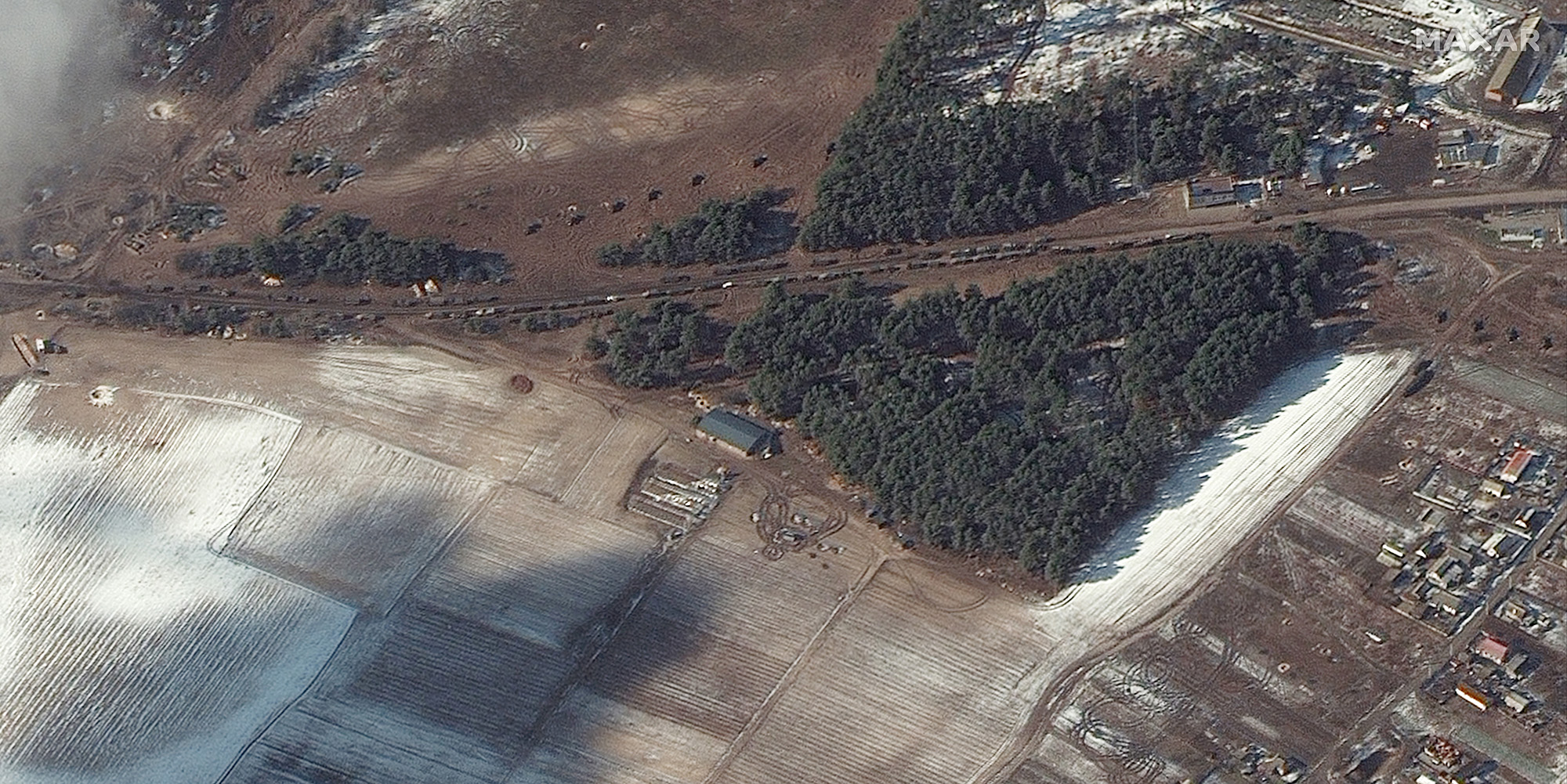 This satellite image provided by Maxar Technologies shows resupply trucks and multiple probable rocket launchers in firing position, in Berestyanka, Ukraine, on&nbsp;March 9.