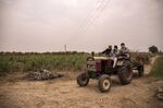 The remains of a funeral pyre in a sugarcane field&nbsp;in the village of Basi, Uttar Pradesh, India, on May 10.