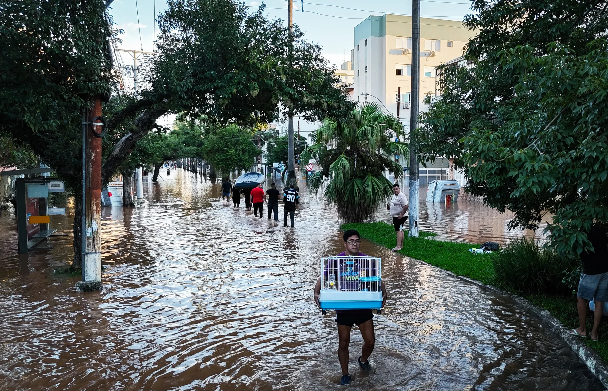 Residents walk through floodwater following heavy rains in Porto Alegre, Rio Grande do Sul state, Brazil, on&nbsp;May 6.