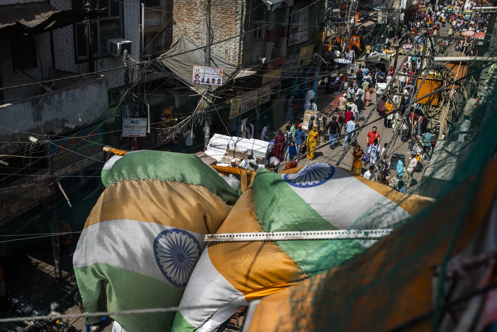 People walk through the Sadar Bazaar in New Delhi, India, on Tuesday, April 18, 2023. India has overtaken China as the world’s most populous nation, according to UN data released on April 19.