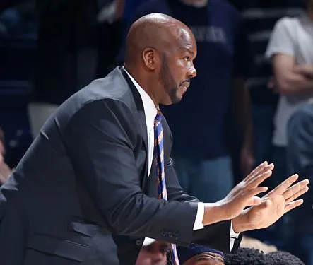 Auburn University assistant coach Chuck Person is charged with corruption.
