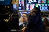 Traders work on the floor of the New York Stock Exchange (NYSE) in New York, U.S., on Monday, March 5, 2018. U.S. stocks turned higher and Treasuries erased gains as investors speculated that President Donald Trump's tough tariff talk won't translate into the most severe protectionist policies.