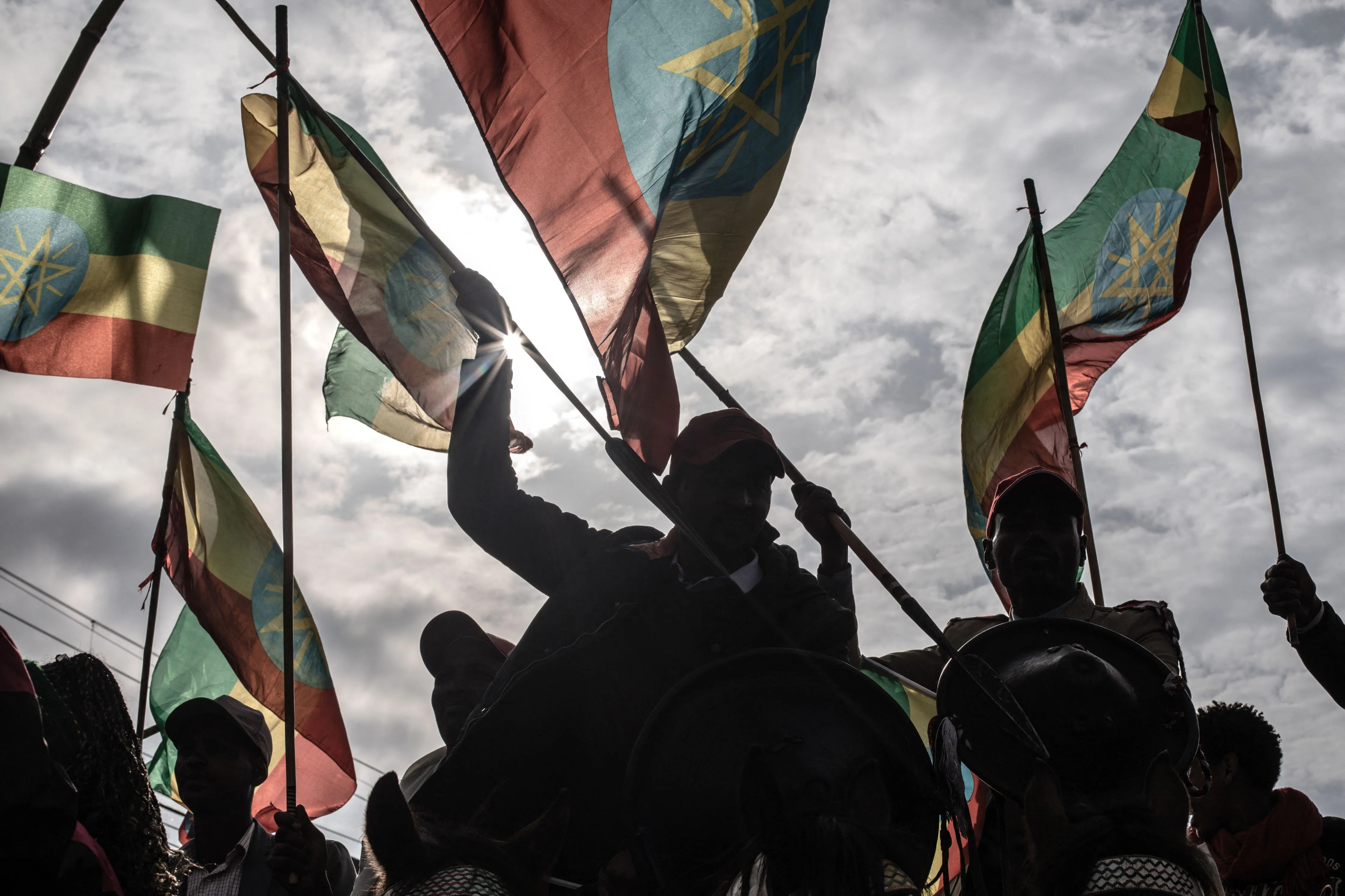 Protesters wave Ethiopian flags during a rally to support armed forces in Addis Ababa.