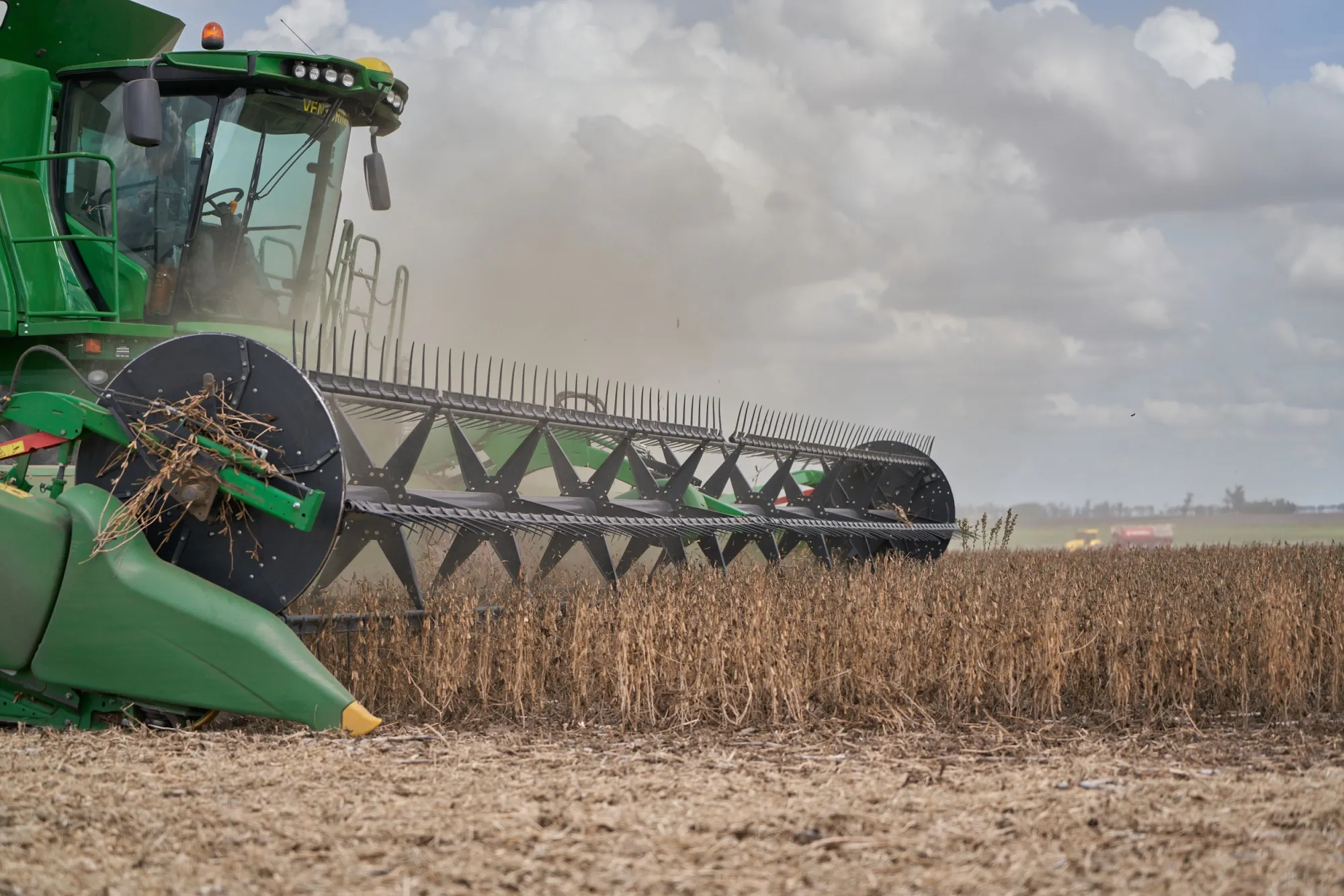 A combine harvester cuts through a field of soybean plants at a drought-affected farm in San Jose de la Esquina, Argentina.