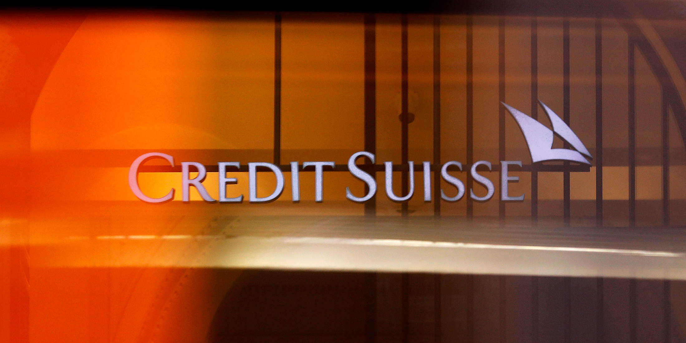 A logo hangs in the entrance to Credit Suisse Group AG's headquarters in Zurich, Switzerland