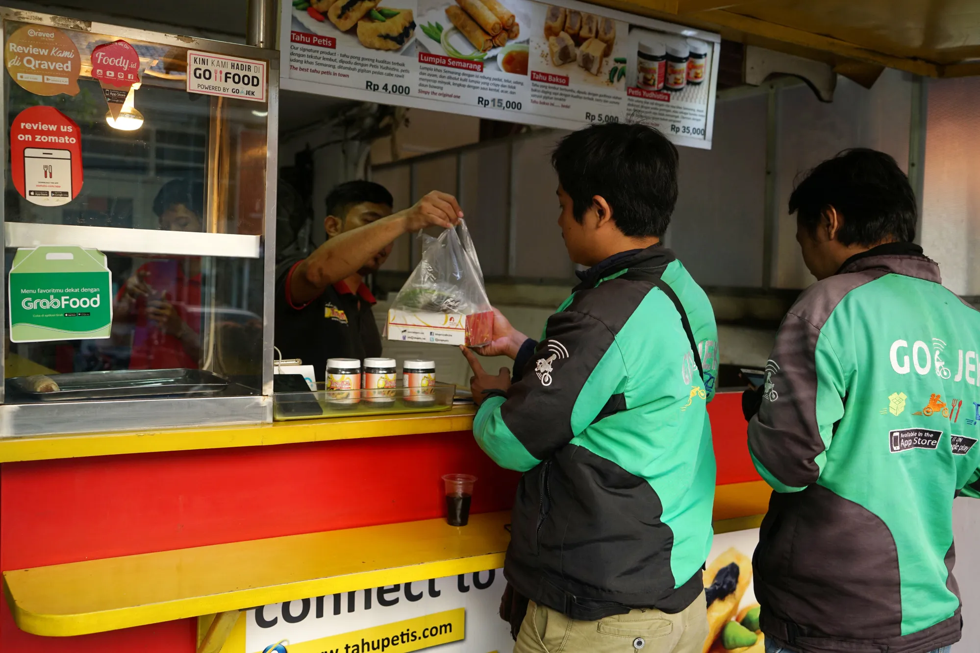 All your personal needs: Go-Jek food delivery workers.