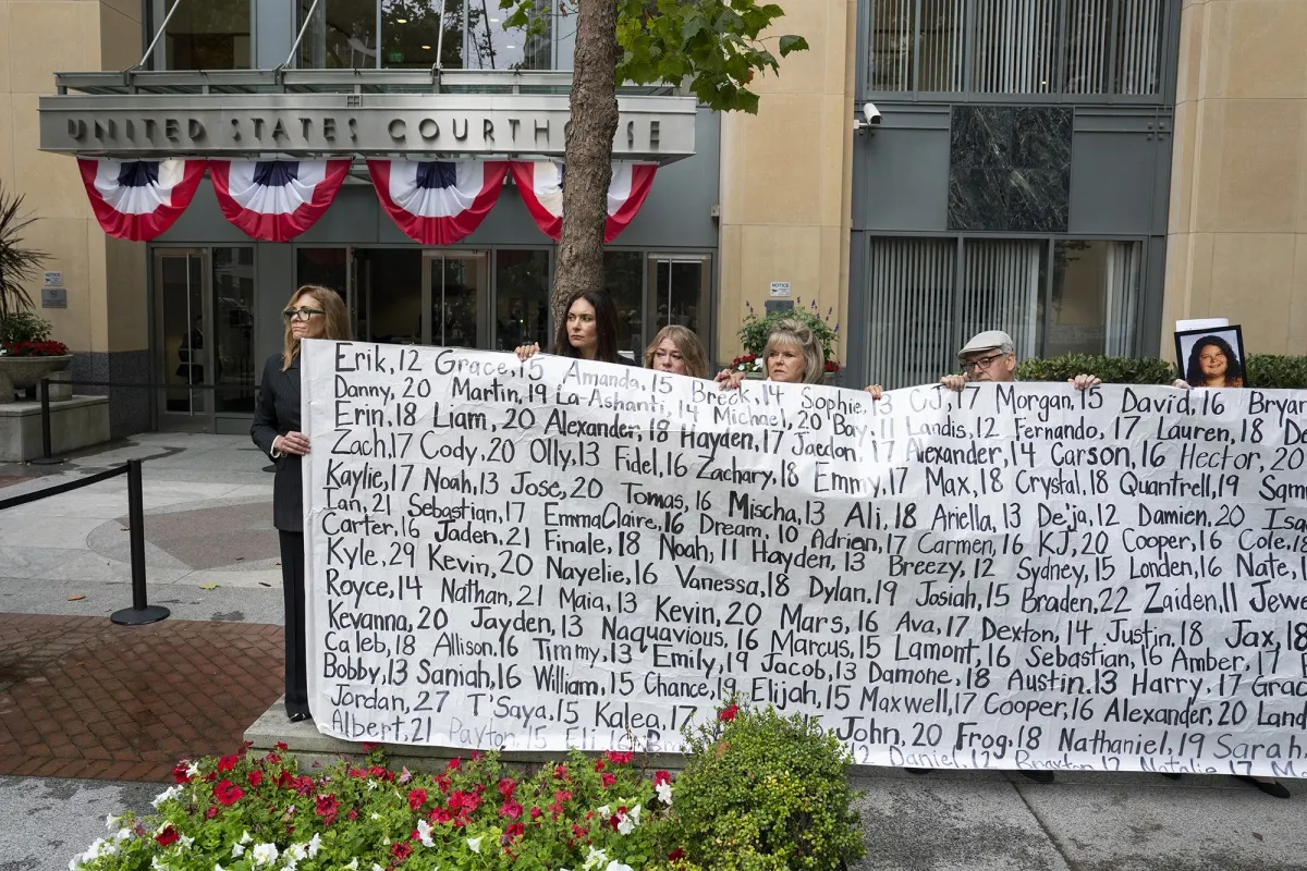 Family members hold a banner with the names of nearly 400 young people who allegedly died from the impacts of social media outside the Ronald V. Dellums Federal Building & United States Courthouse in Oakland, California, on Aug. 18.