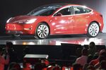 1504482147_tesla red car