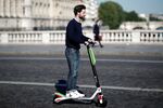 LimeBike's France's director Arthur-Louis Jacquier riding a LimeBike Scooter on their Paris launch day, Friday