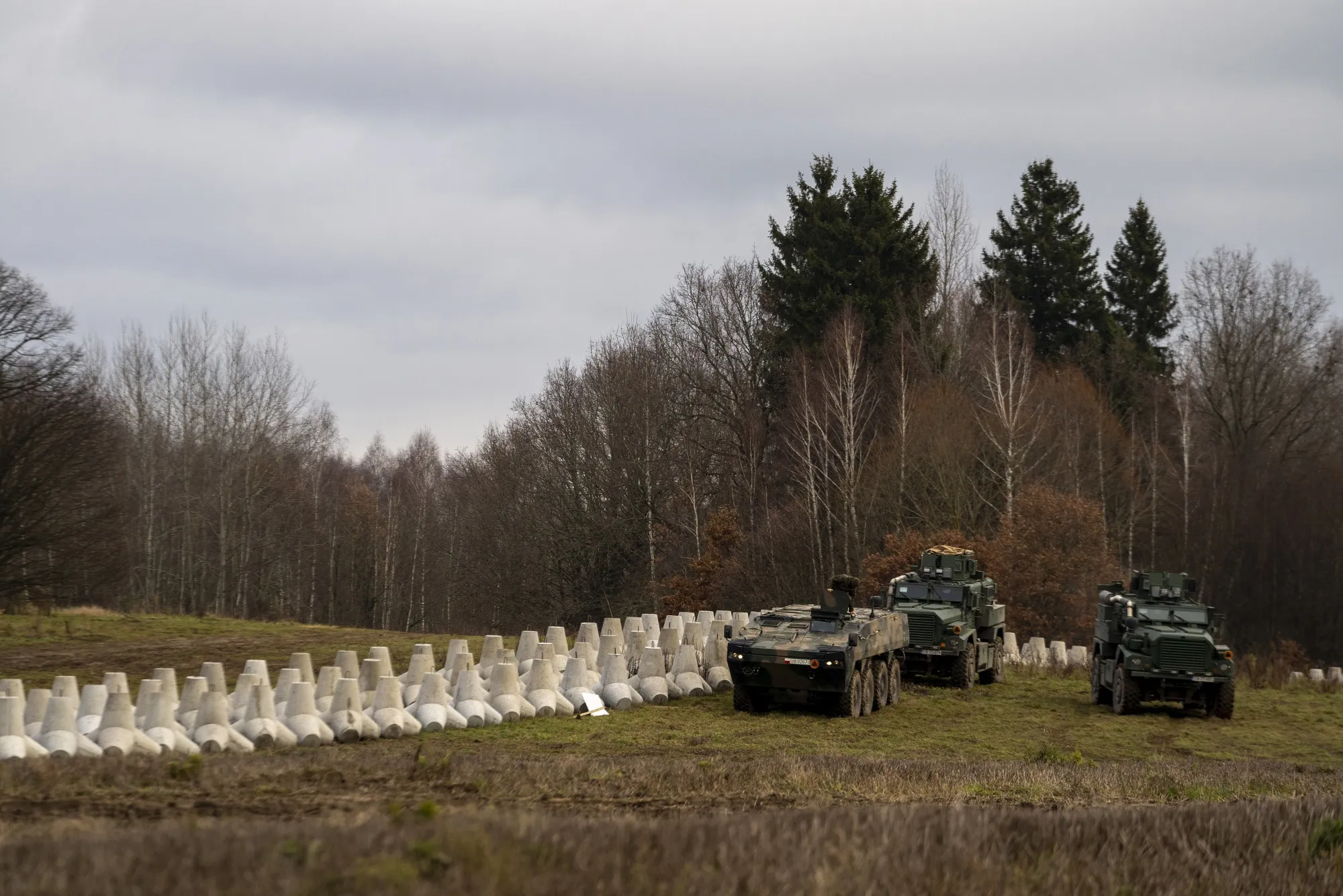 Armored vehicles of the Polish army beside anti-tank defences at the first built part of the East Shield at Poland's border with Russia, in Dabrowka, Poland.