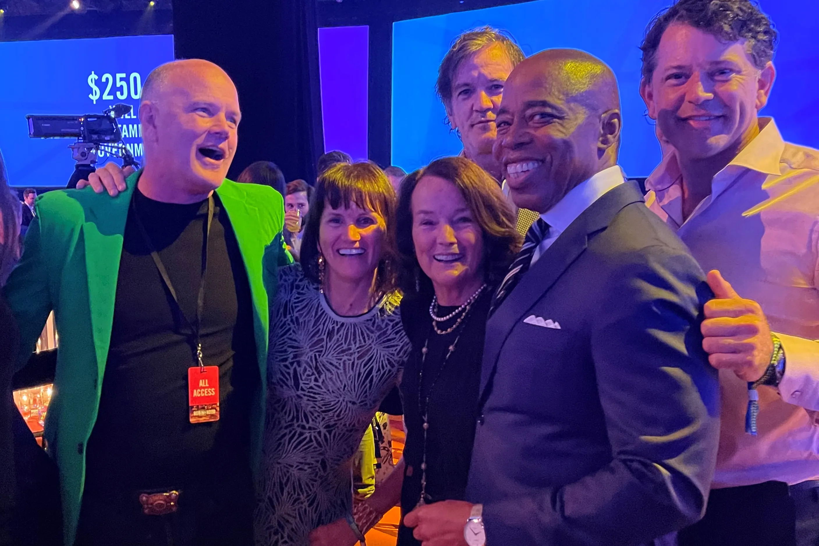 Eric Adams poses with members of the Novogratz family, including Mike Novogratz, far left, and John Novogratz, far right.