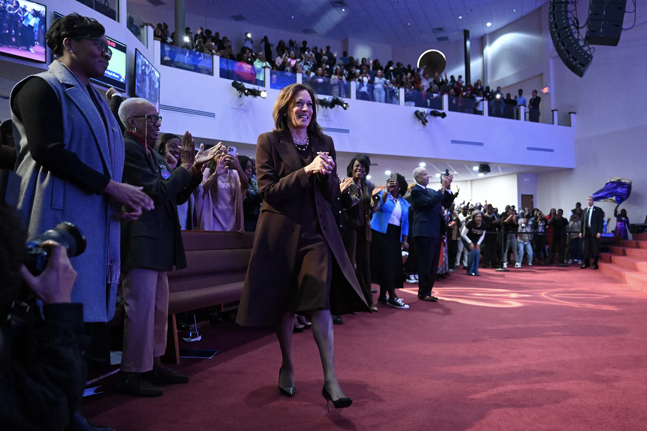 Kamala Harris walks to the stage at the Church of Christian Compassion, during a campaign stop in Philadelphia, Pennsylvania, on Oct. 27, 2024.
