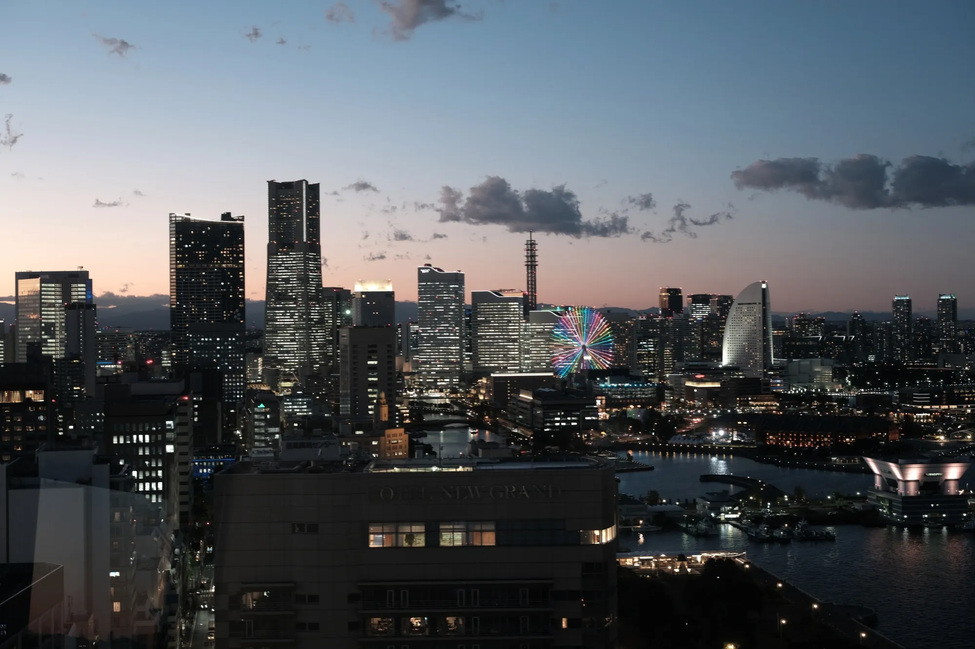 Buildings illuminated at dusk in Yokohama.