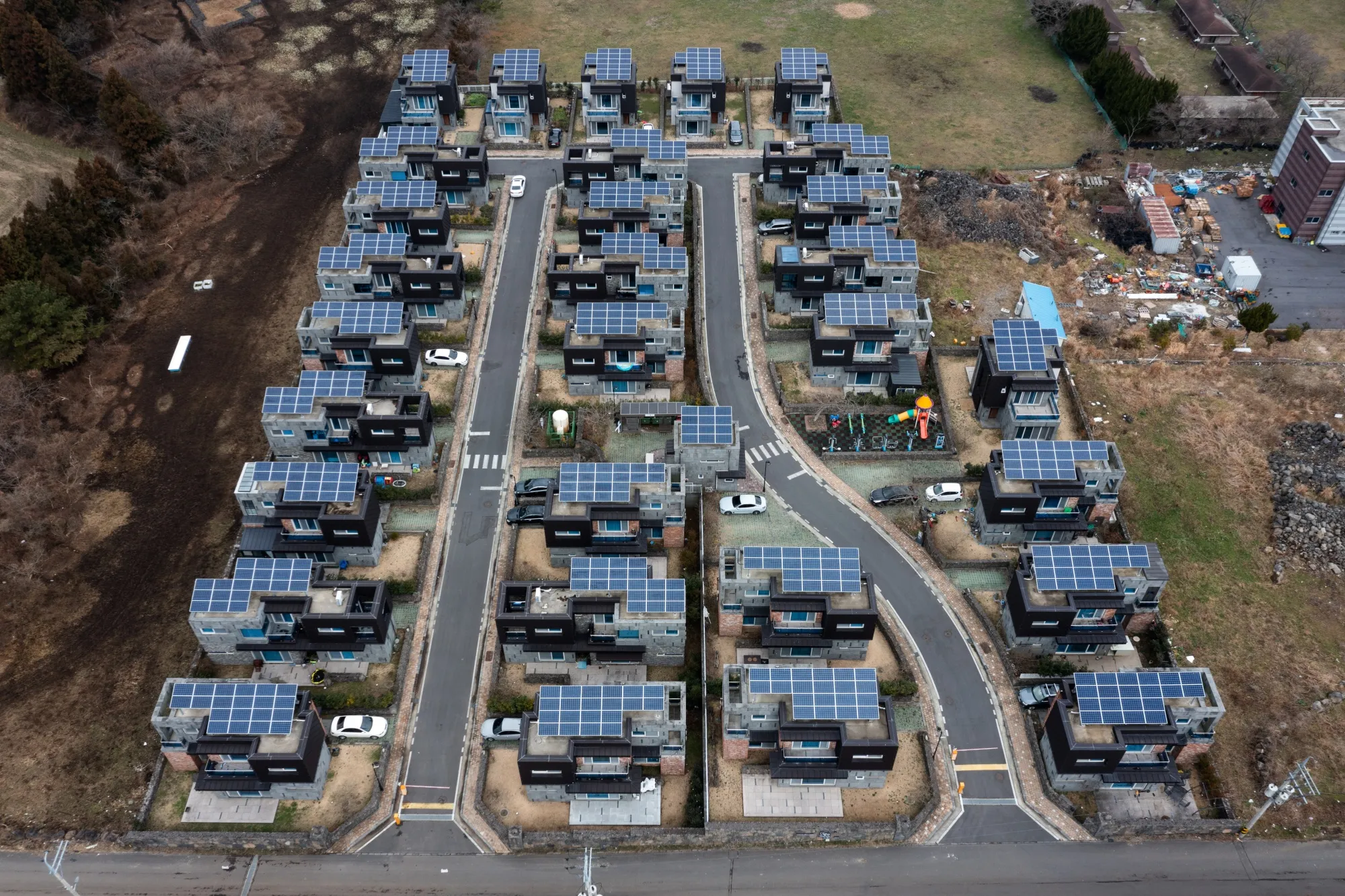 Solar panels on the roofs of residential houses in Jeju, South Korea.