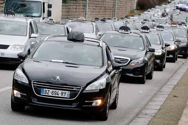 Taxi drivers demonstrate near Paris on Jan. 13