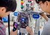Korea Advanced Institute of Science and Technology students work on a robot in the lab