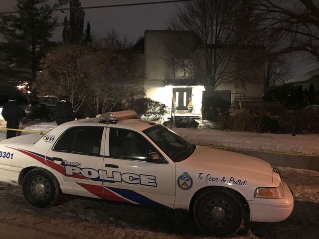 Police outside the Shermans’ house after their bodies were discovered.