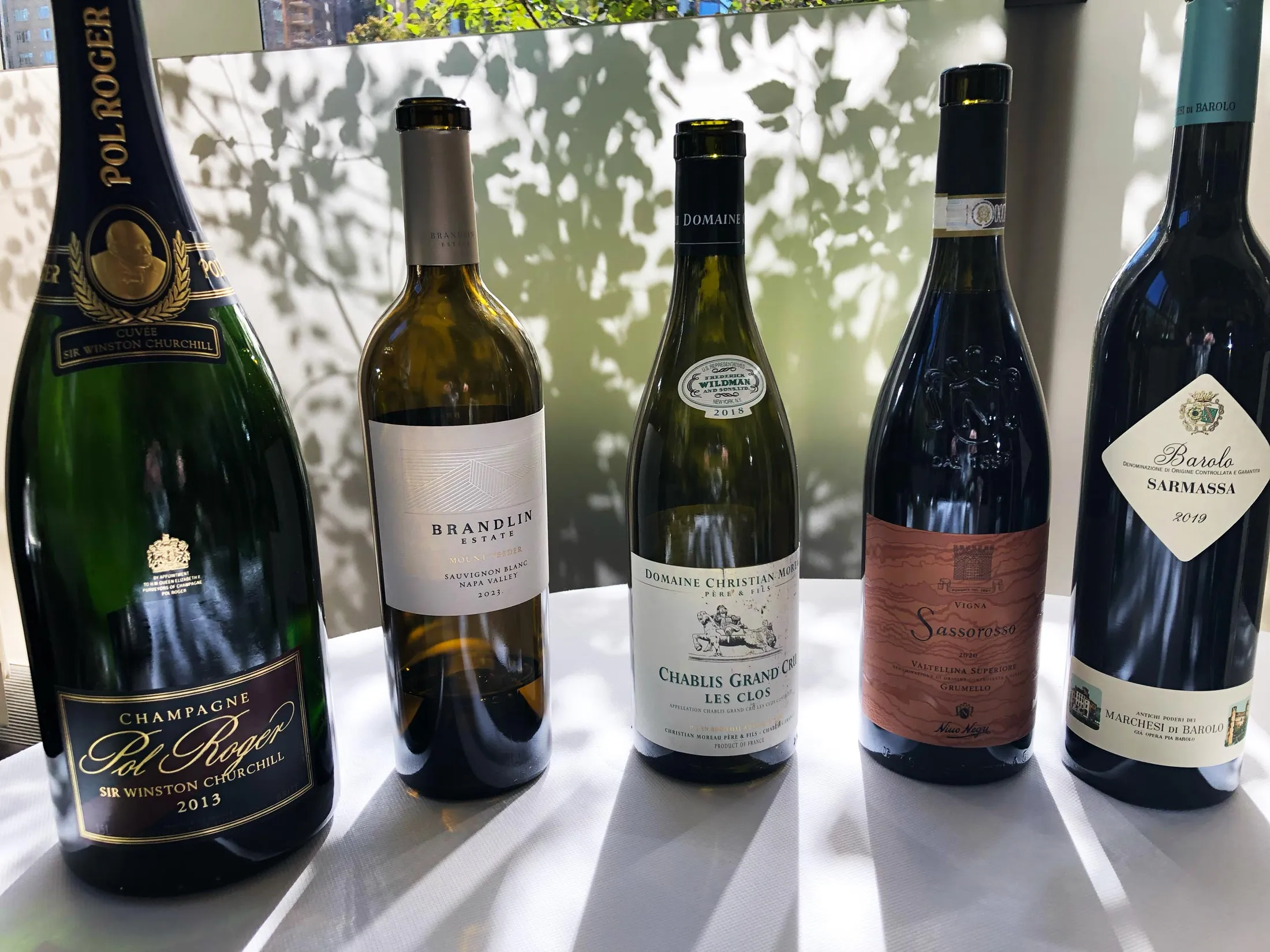 A lineup of wines tasted at Jean Georges during the 2025 New York Wine Experience