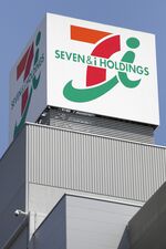 Signage for Seven & I Holdings Co. is displayed atop the company's Ito-Yokado supermarket in Tokyo, Japan