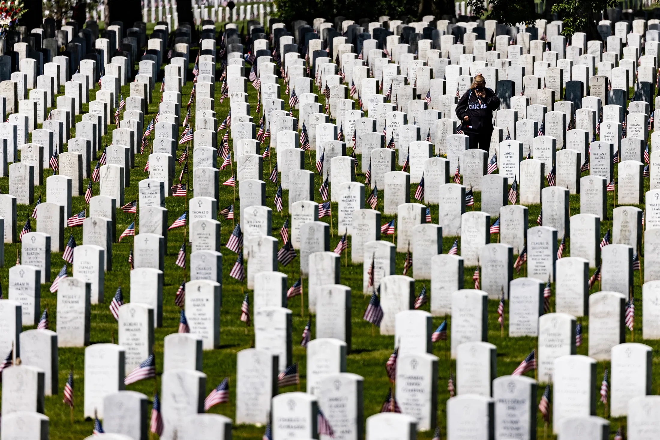 &nbsp;A woman walks amongst the headstones of those killed during the wars in Iraq and Afghanistan in Section 60 of Arlington National Cemetery in Arlington, Virginia, on&nbsp;May 31, 2021.